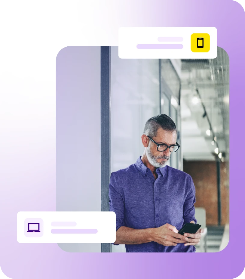 Man stood in hallway using mobile phone