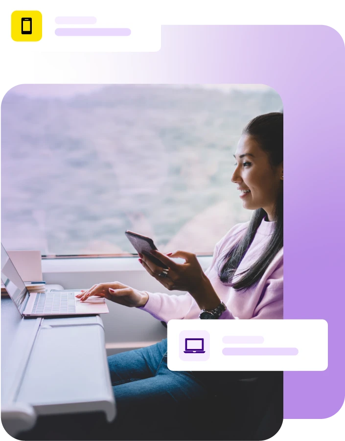 Lady on train using laptop and mobile phone