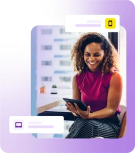 Lady smiling while sat using a tablet device