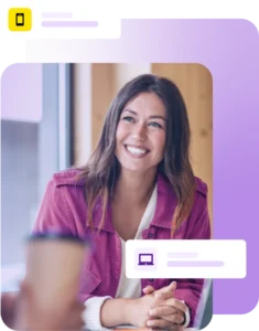 Lady smiling during a meeting with laptop on the table