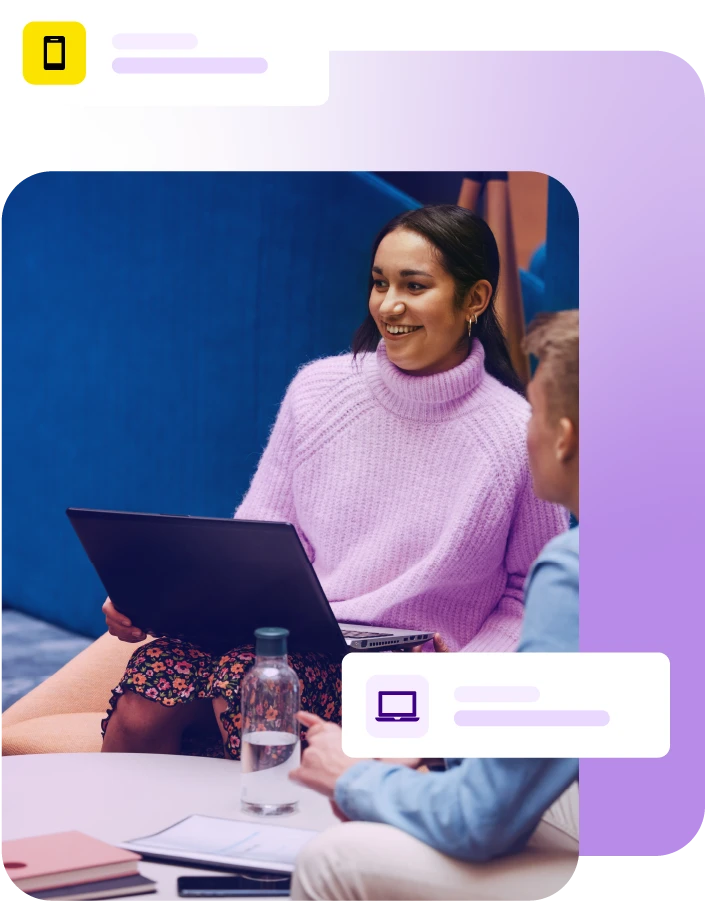 Lady sat with laptop during a group meeting