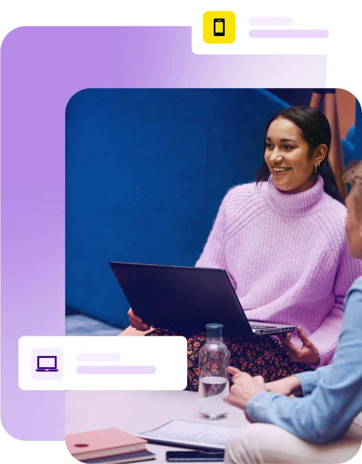 Lady sat with laptop during a group meeting