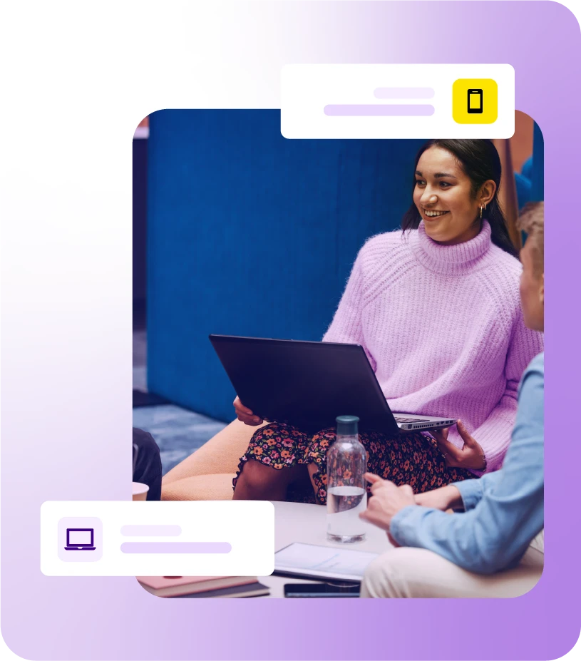 Lady sat with laptop during a group meeting