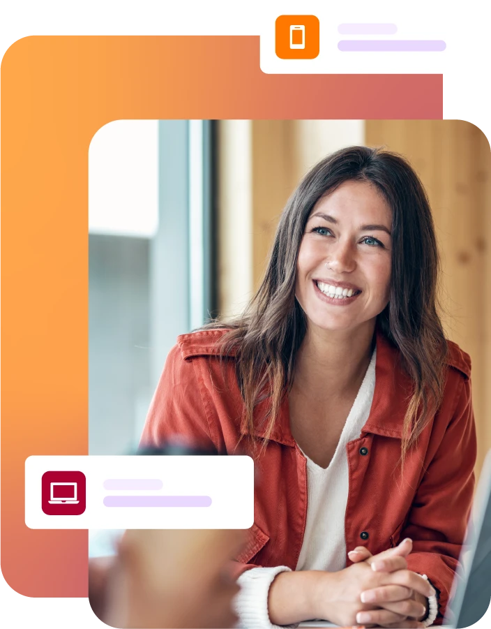 Lady smiling during a meeting with laptop on the table