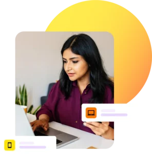 Lady looking at laptop while on phone