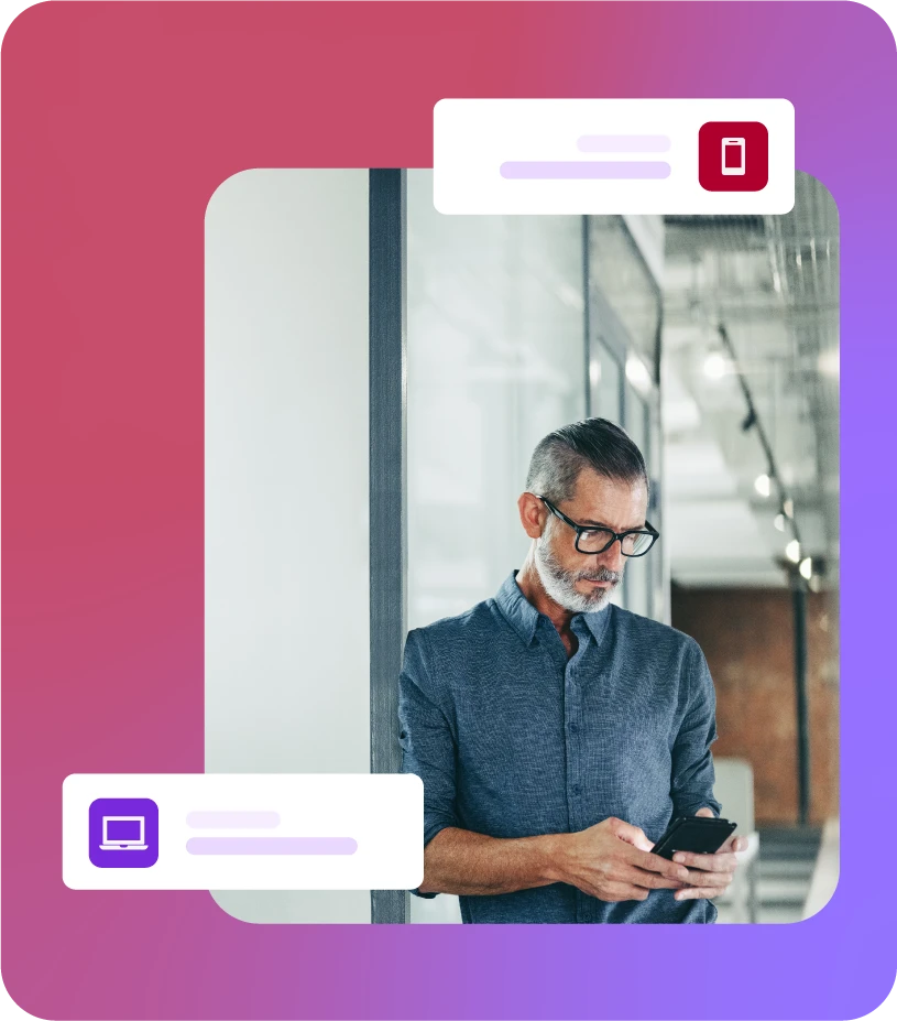 Man stood in hallway using mobile phone