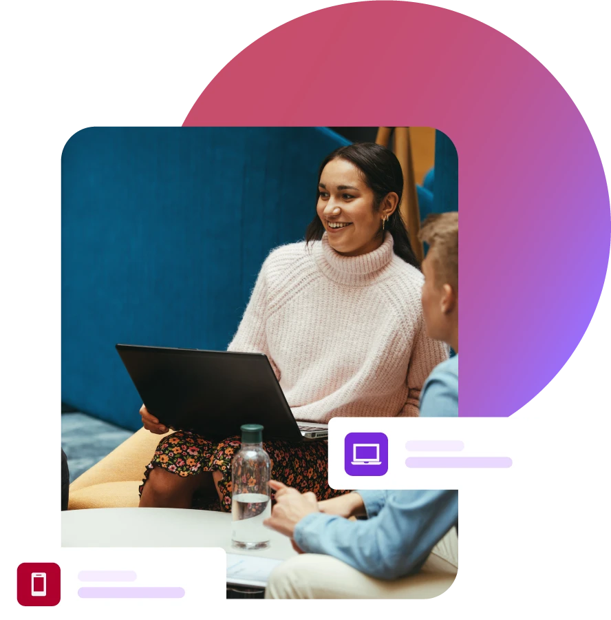 Lady sat with laptop during a group meeting