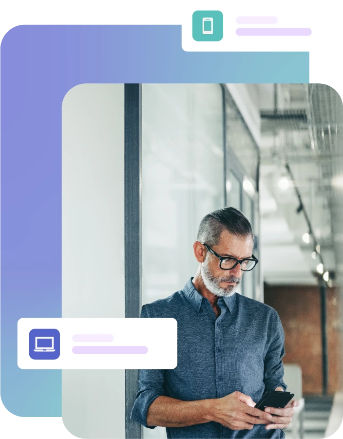 Man stood in hallway using mobile phone