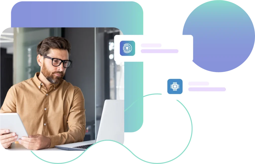 Man on a laptop and tablet device