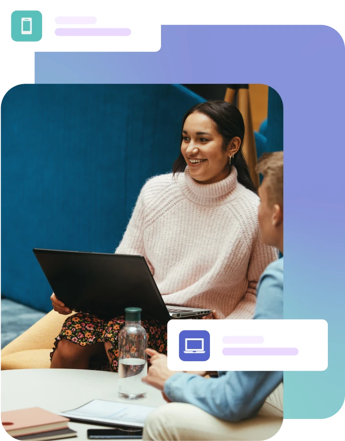 Lady sat with laptop during a group meeting