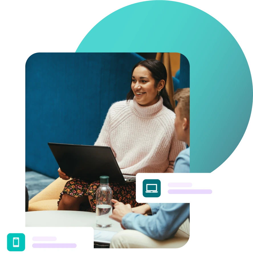 Lady sat with laptop during a group meeting