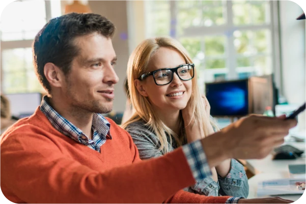 Lady and man using screen