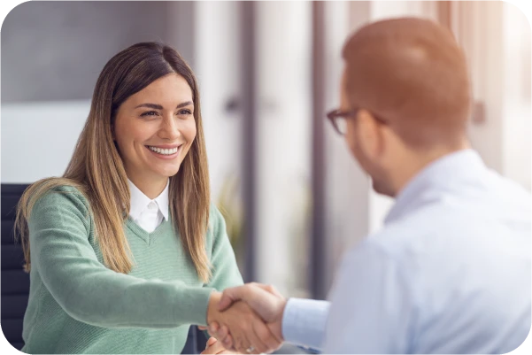 Lady and man shaking hands